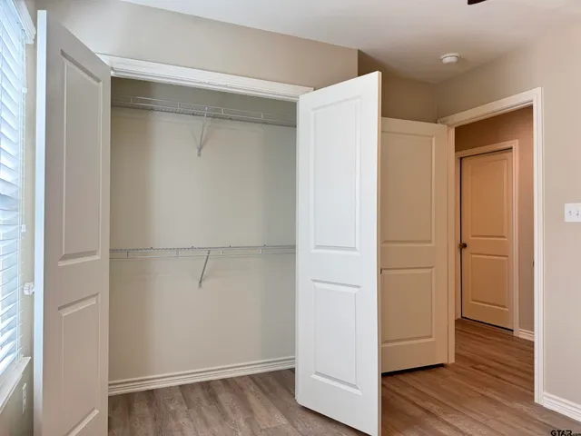 a view of a backyard with wooden fence