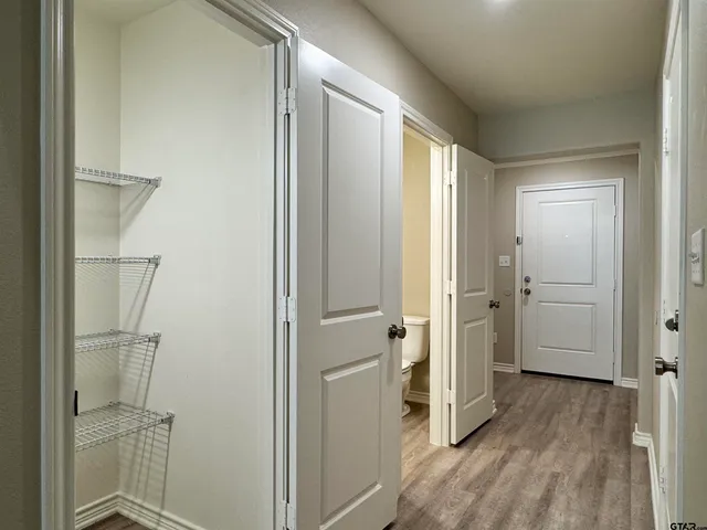 a bathroom with a glass shower door