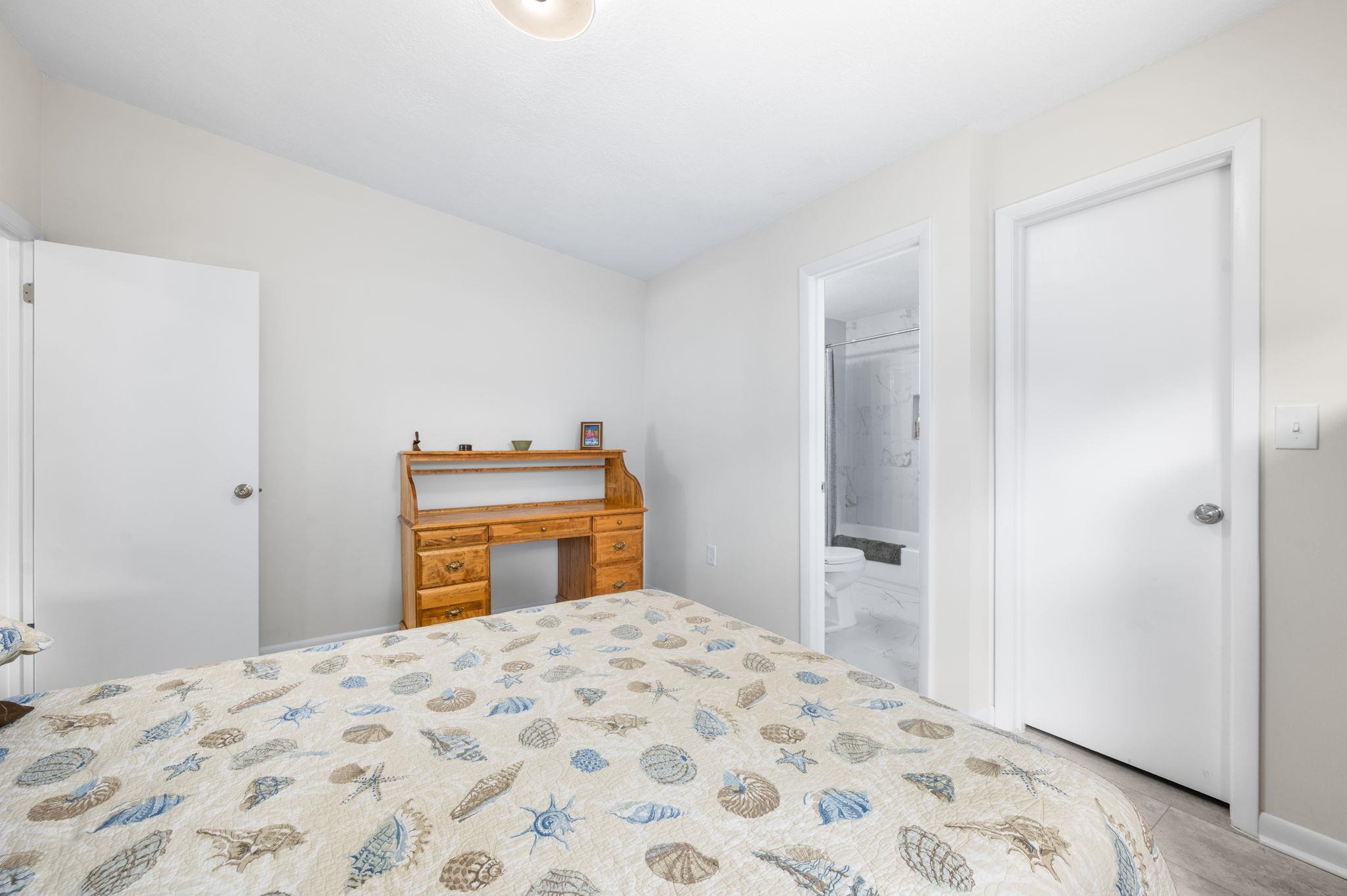 507 Gentian Road St. Augustine, FL 32086 - Photo 32 of 82 a bedroom with a bed and a dresser