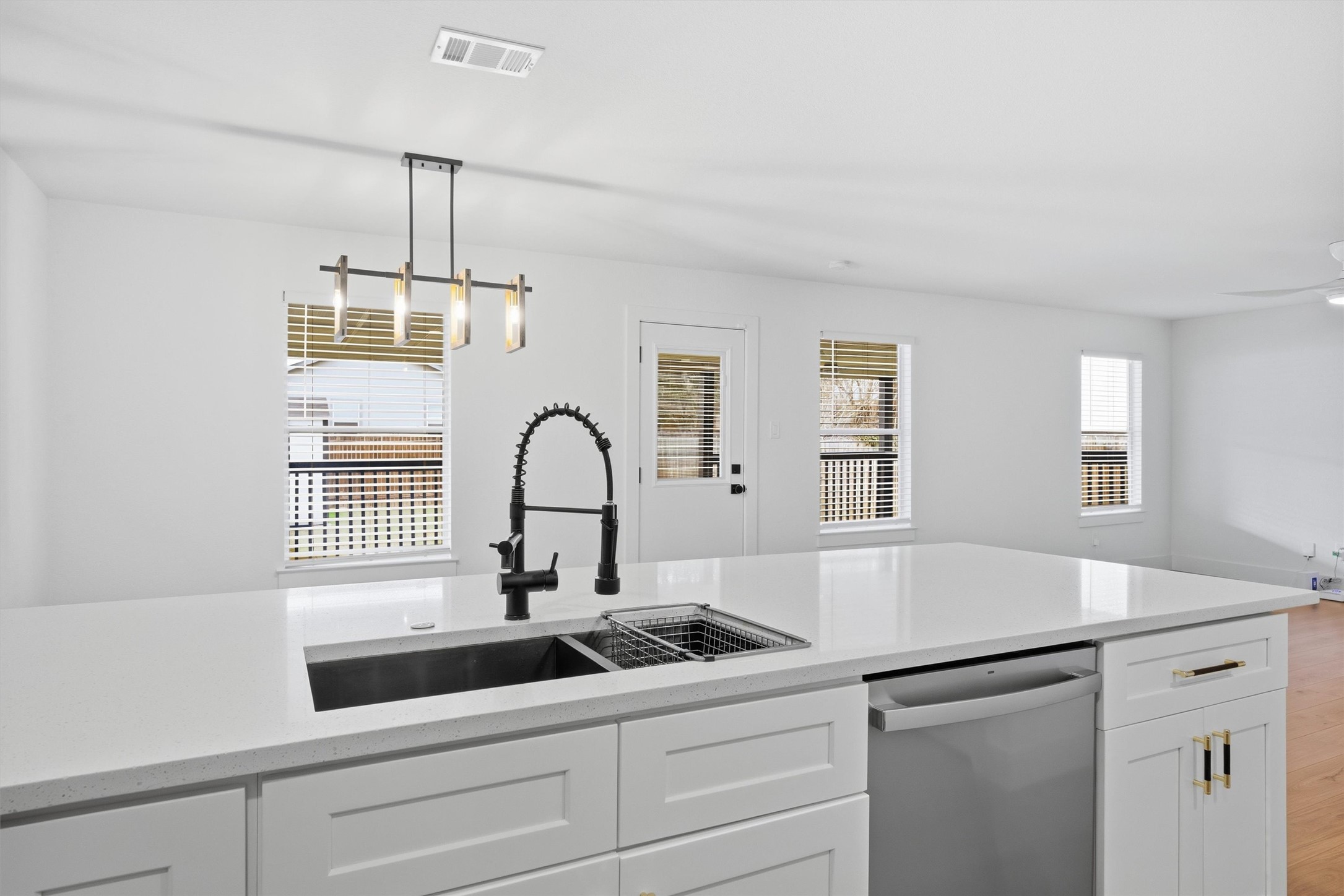 6708 Panda Royle Drive Del Valle, TX 78617 - Photo 16 of 40 a kitchen with a sink and chandelier
