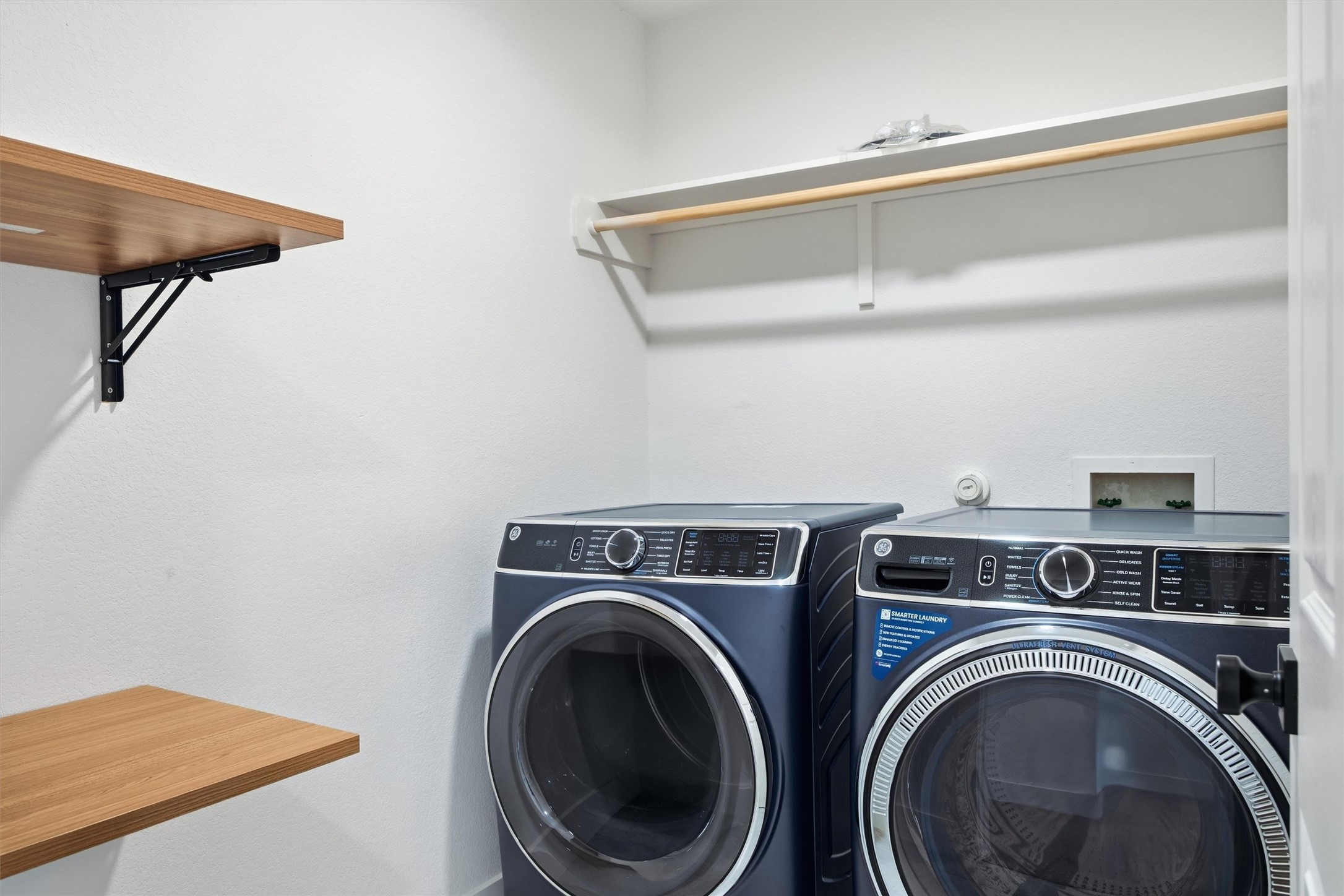 6708 Panda Royle Drive Del Valle, TX 78617 - Photo 18 of 40 a view of storage and utility room with washer and dryer