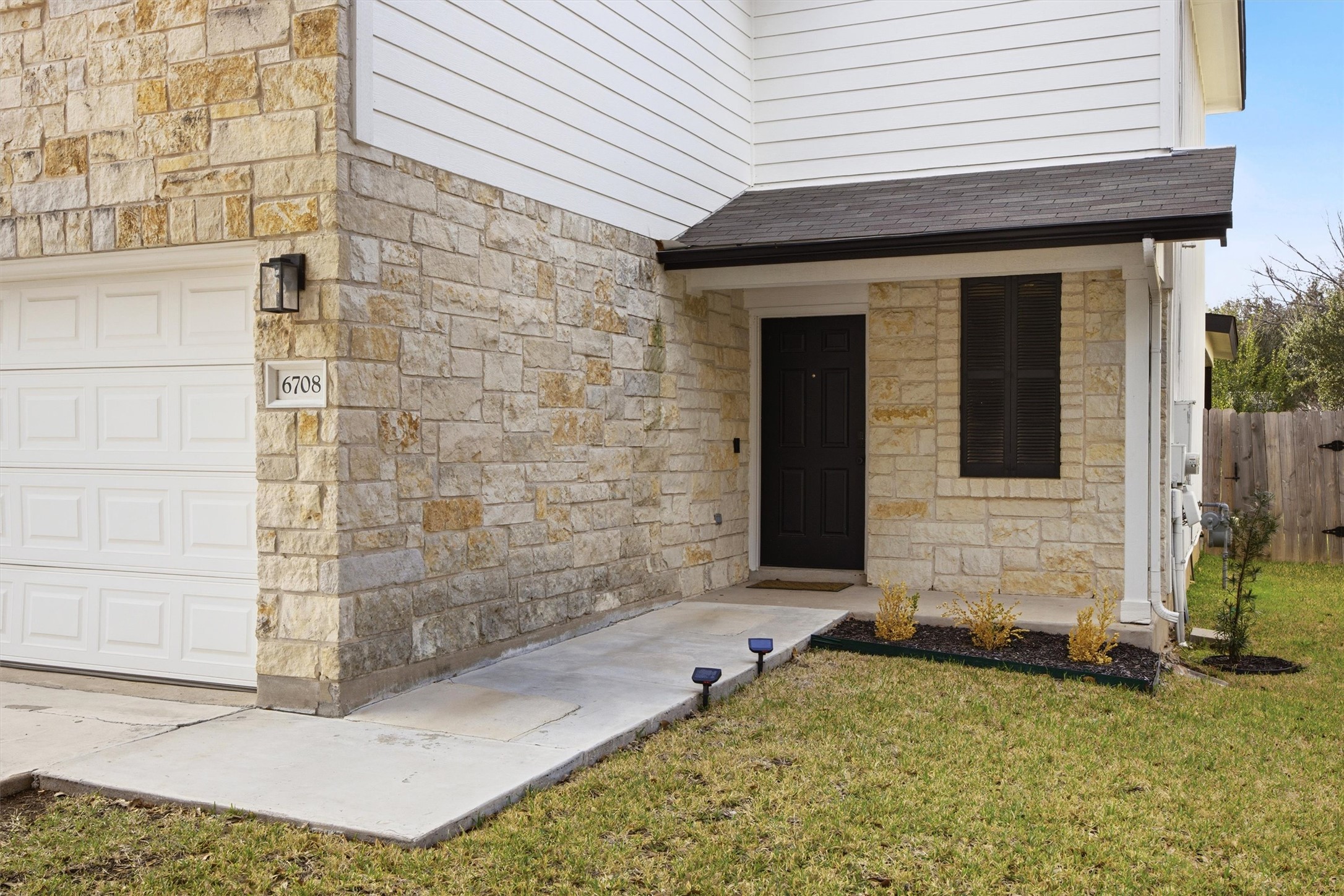 6708 Panda Royle Drive Del Valle, TX 78617 - Photo 2 of 40 a front view of a house with a yard