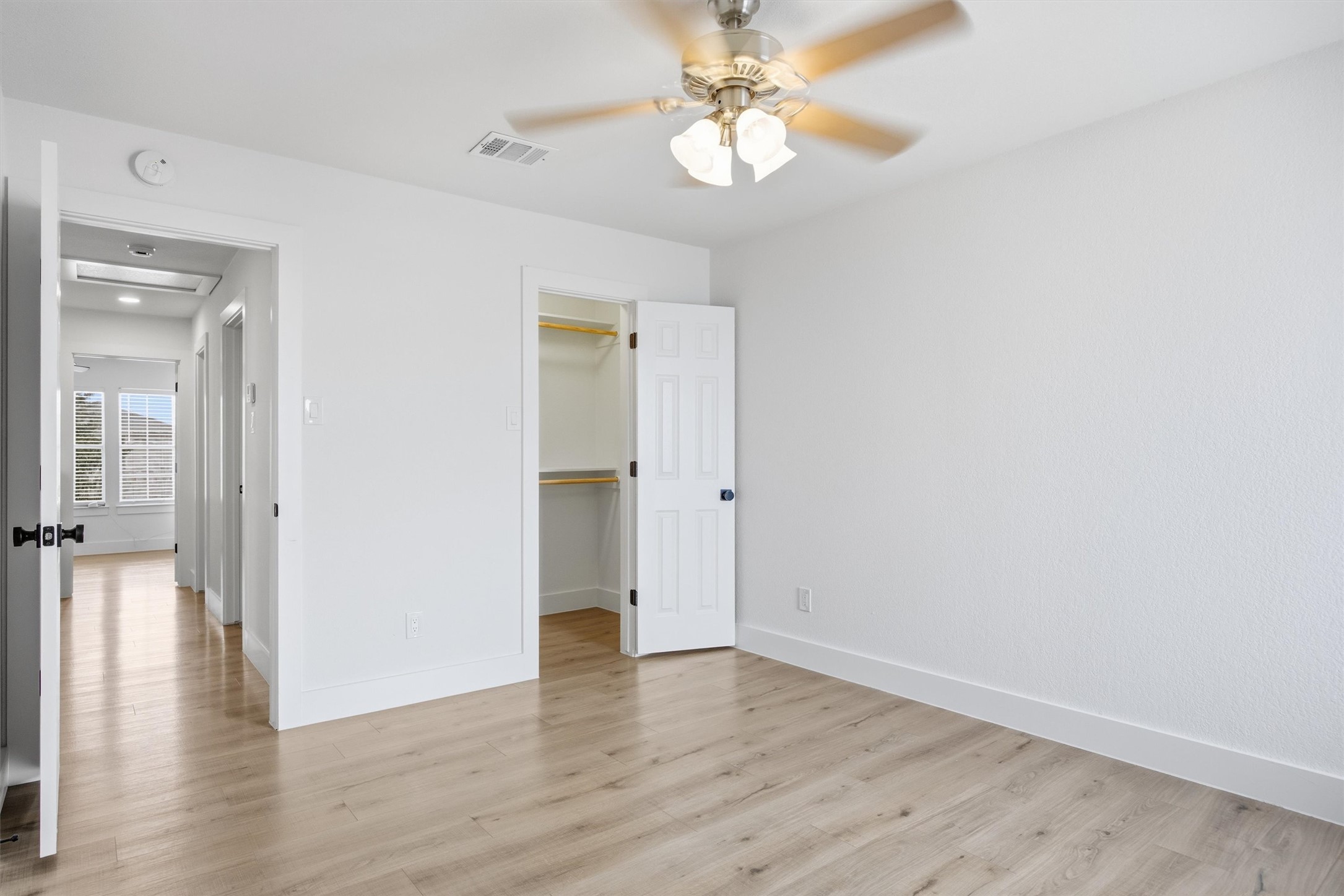 6708 Panda Royle Drive Del Valle, TX 78617 - Photo 21 of 40 a view of an empty room with wooden floor