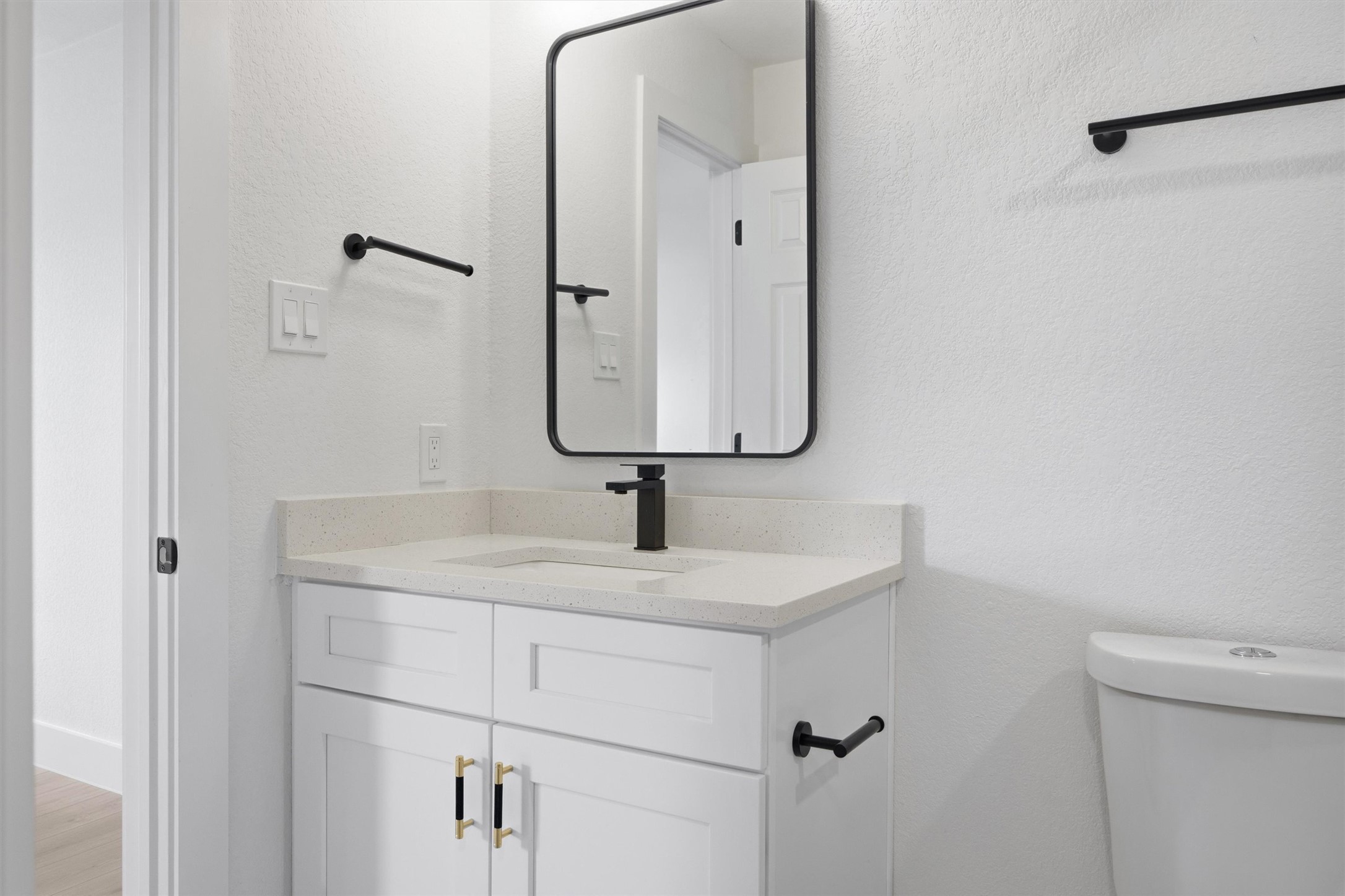 6708 Panda Royle Drive Del Valle, TX 78617 - Photo 27 of 40 a bathroom with a sink and a mirror
