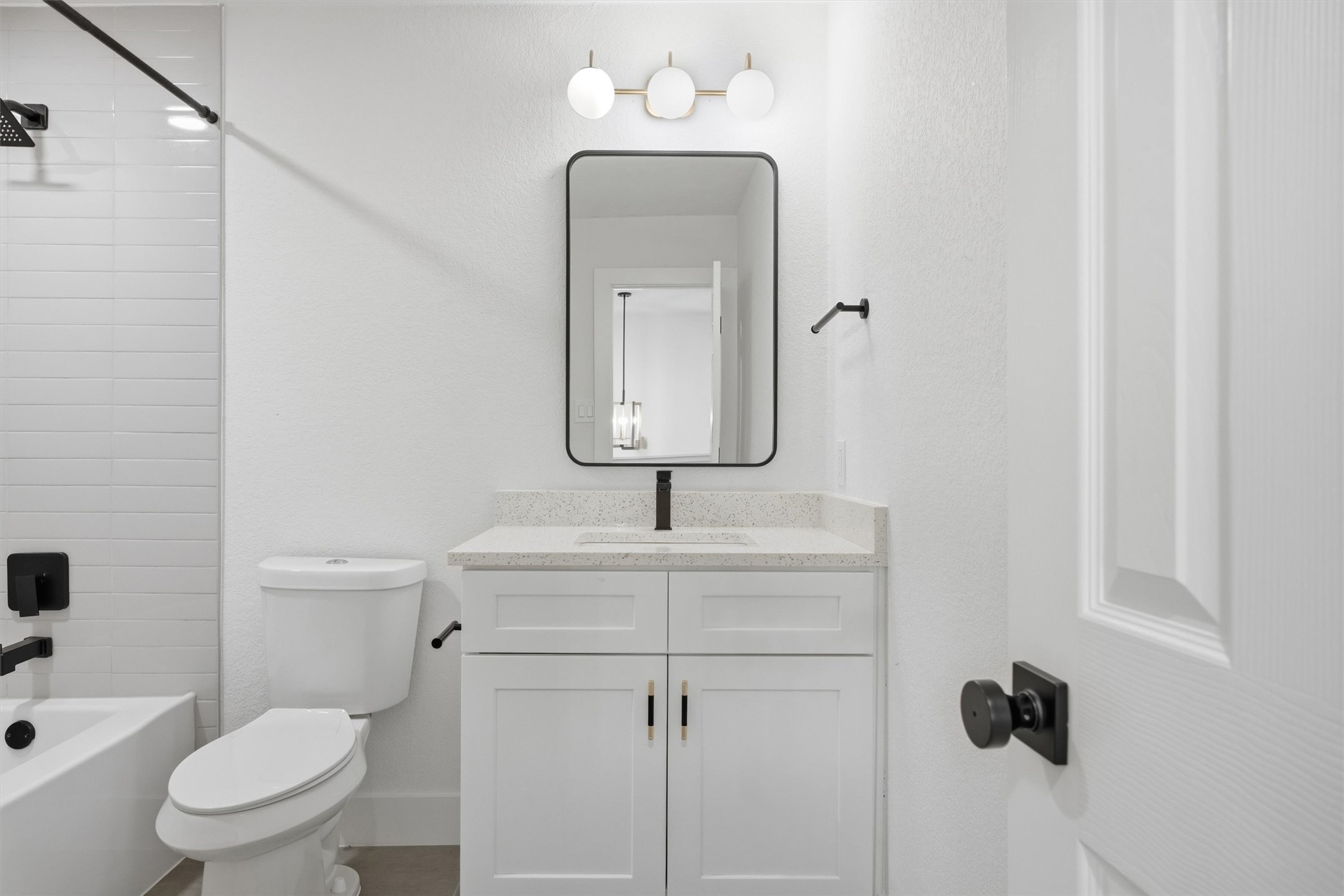 6708 Panda Royle Drive Del Valle, TX 78617 - Photo 29 of 40 a bathroom with a toilet sink and mirror