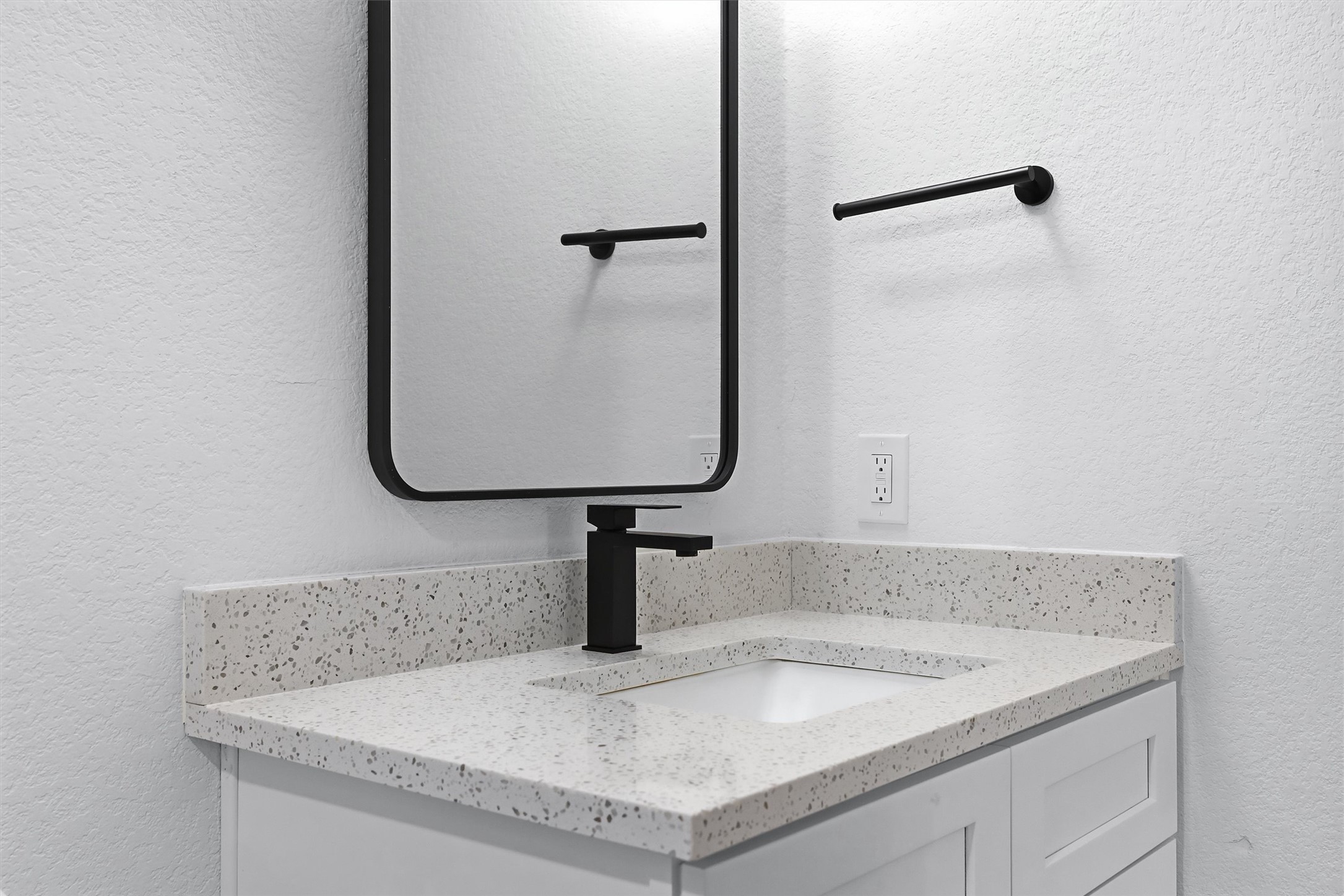 6708 Panda Royle Drive Del Valle, TX 78617 - Photo 31 of 40 a bathroom with a granite countertop sink and mirror