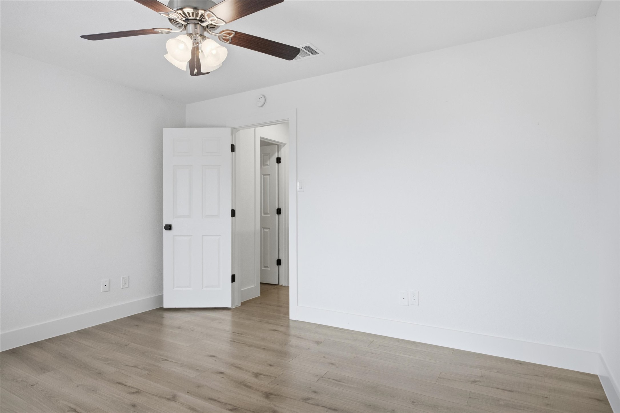 6708 Panda Royle Drive Del Valle, TX 78617 - Photo 33 of 40 a view of an empty room with wooden floor