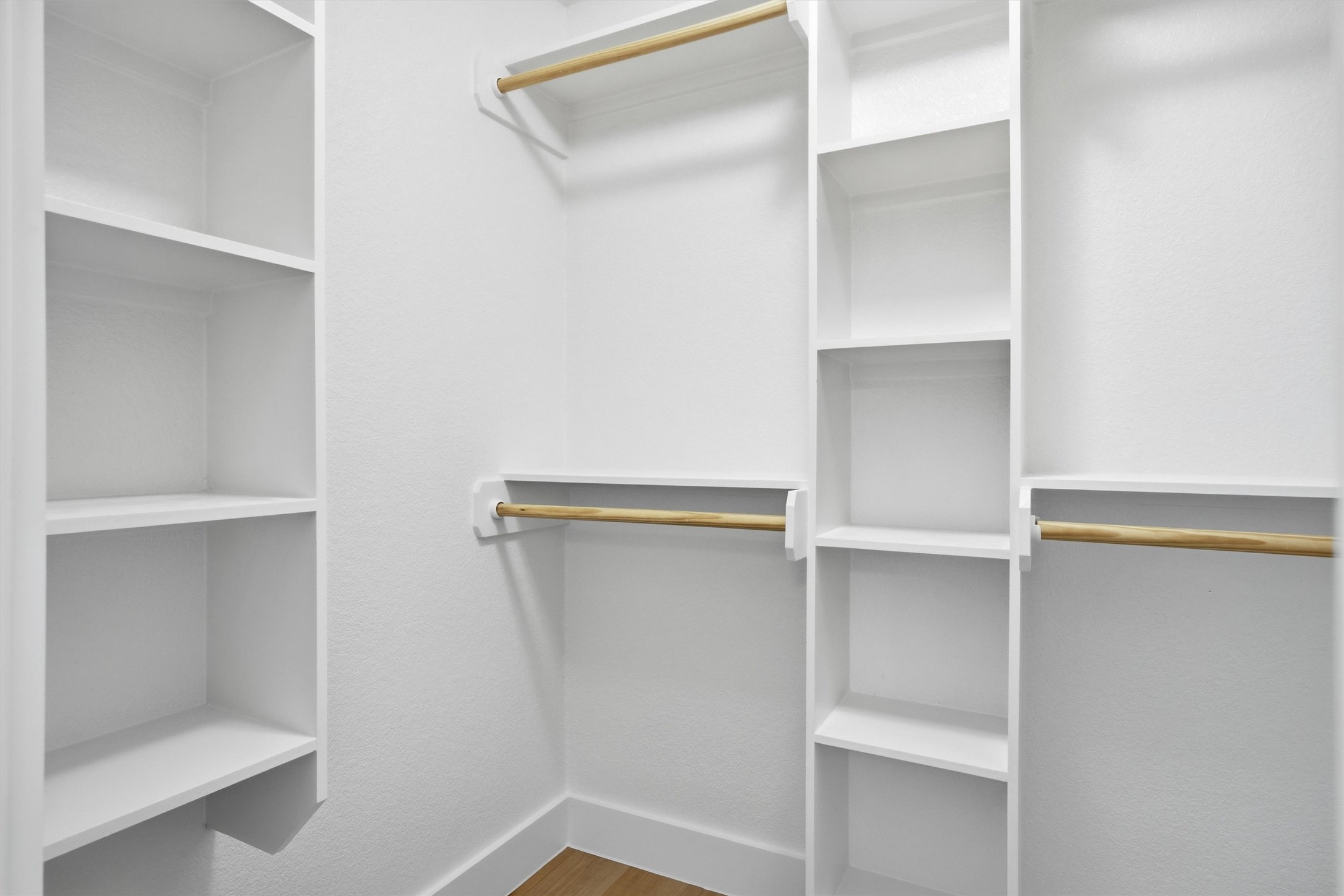 6708 Panda Royle Drive Del Valle, TX 78617 - Photo 35 of 40 a close view of closet with racks on the wall