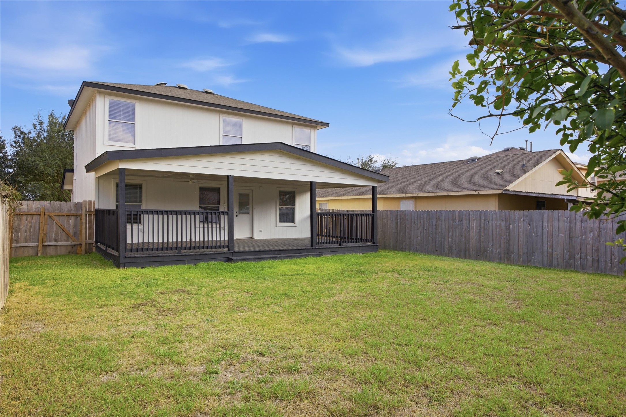 6708 Panda Royle Drive Del Valle, TX 78617 - Photo 40 of 40 a view of a house with a yard and wooden fence