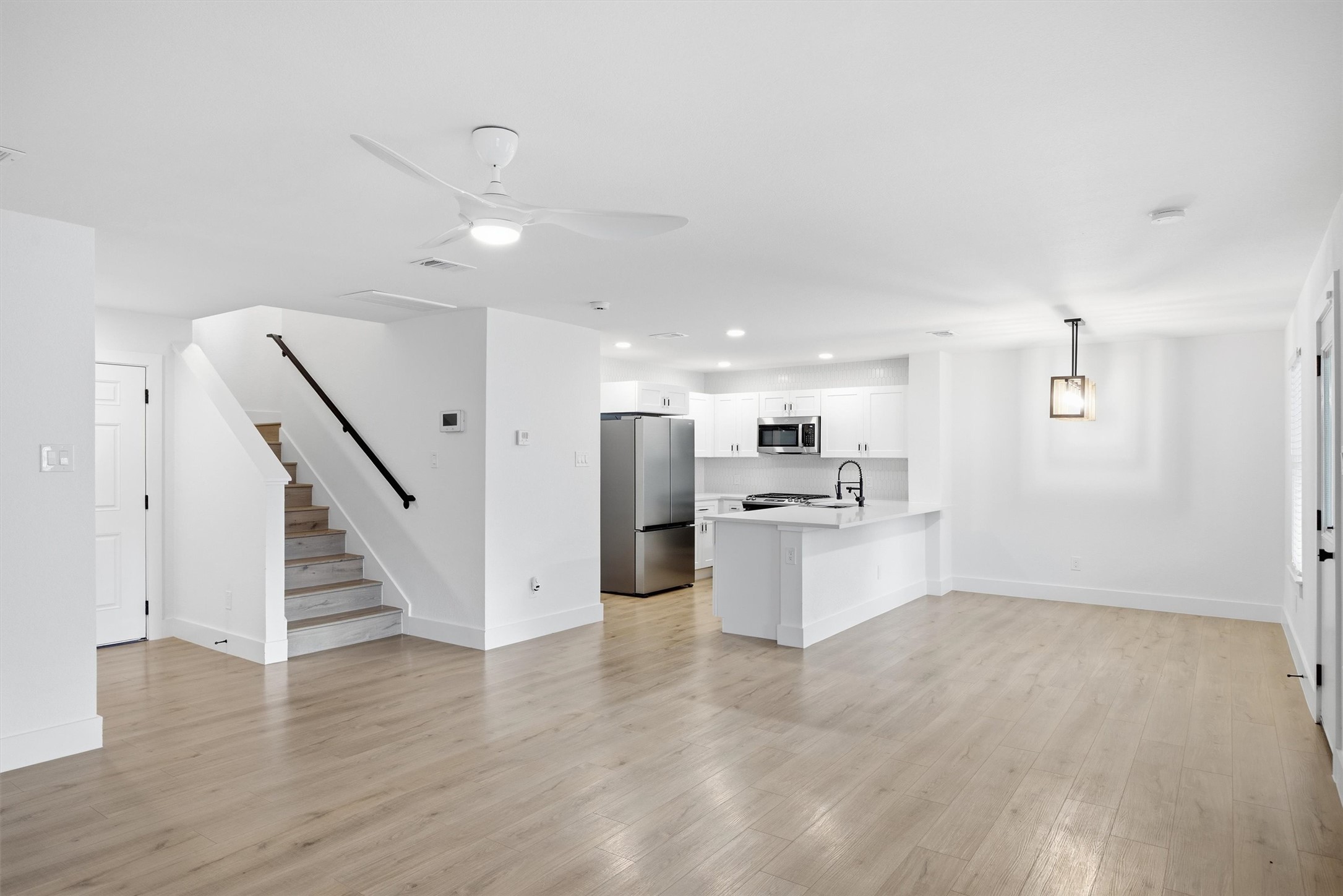 6708 Panda Royle Drive Del Valle, TX 78617 - Photo 10 of 40 a view of kitchen with wooden floor and electronic appliances