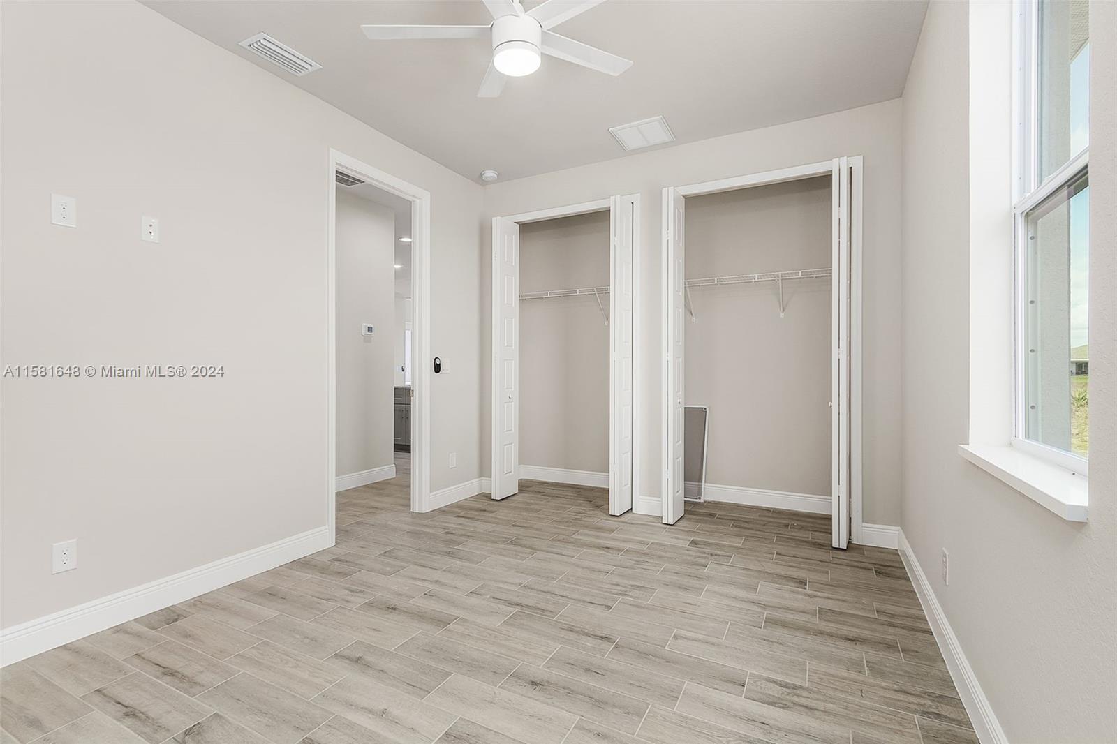 8035 Melody Circle LaBelle, FL 33935 - Photo 17 of 20 an empty room with wooden floor