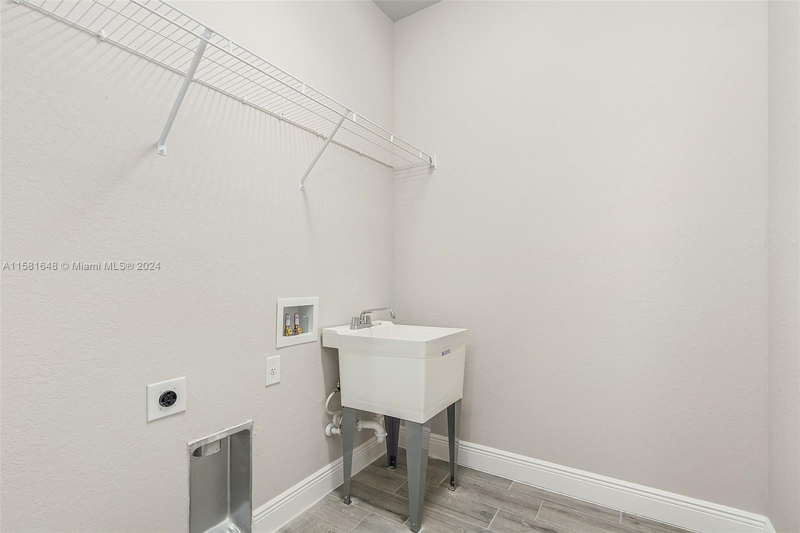8035 Melody Circle LaBelle, FL 33935 - Photo 20 of 20 a bathroom with a sink a light fixture and a toilet