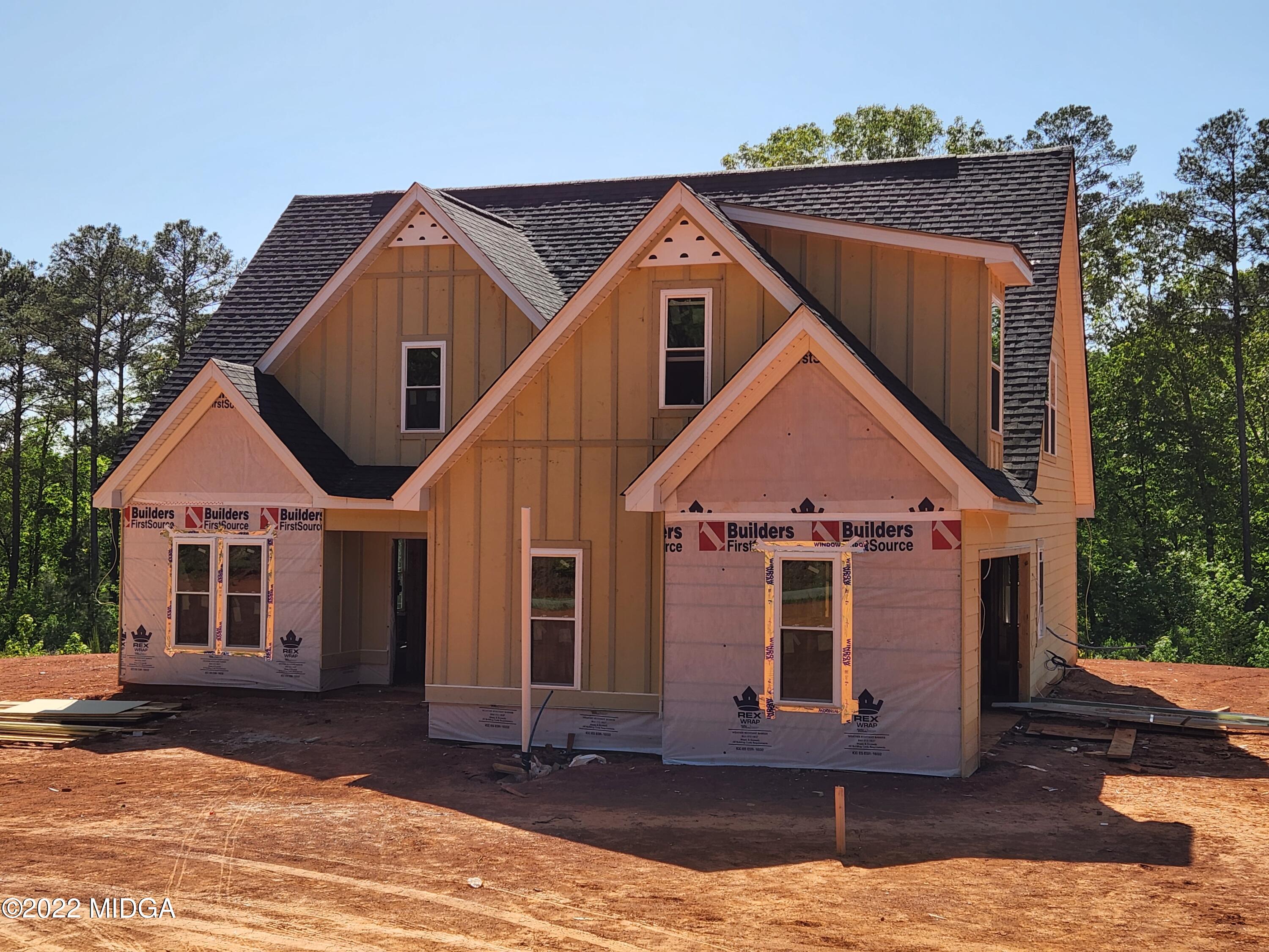 65 Jenkins Road Forsyth, GA 31029 - Photo 2 of 10 a front view of a house with a yard