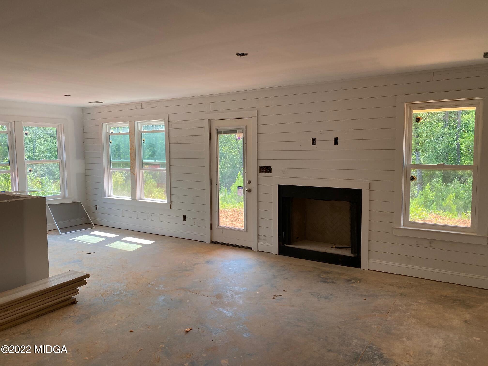 65 Jenkins Road Forsyth, GA 31029 - Photo 3 of 10 an empty room with windows