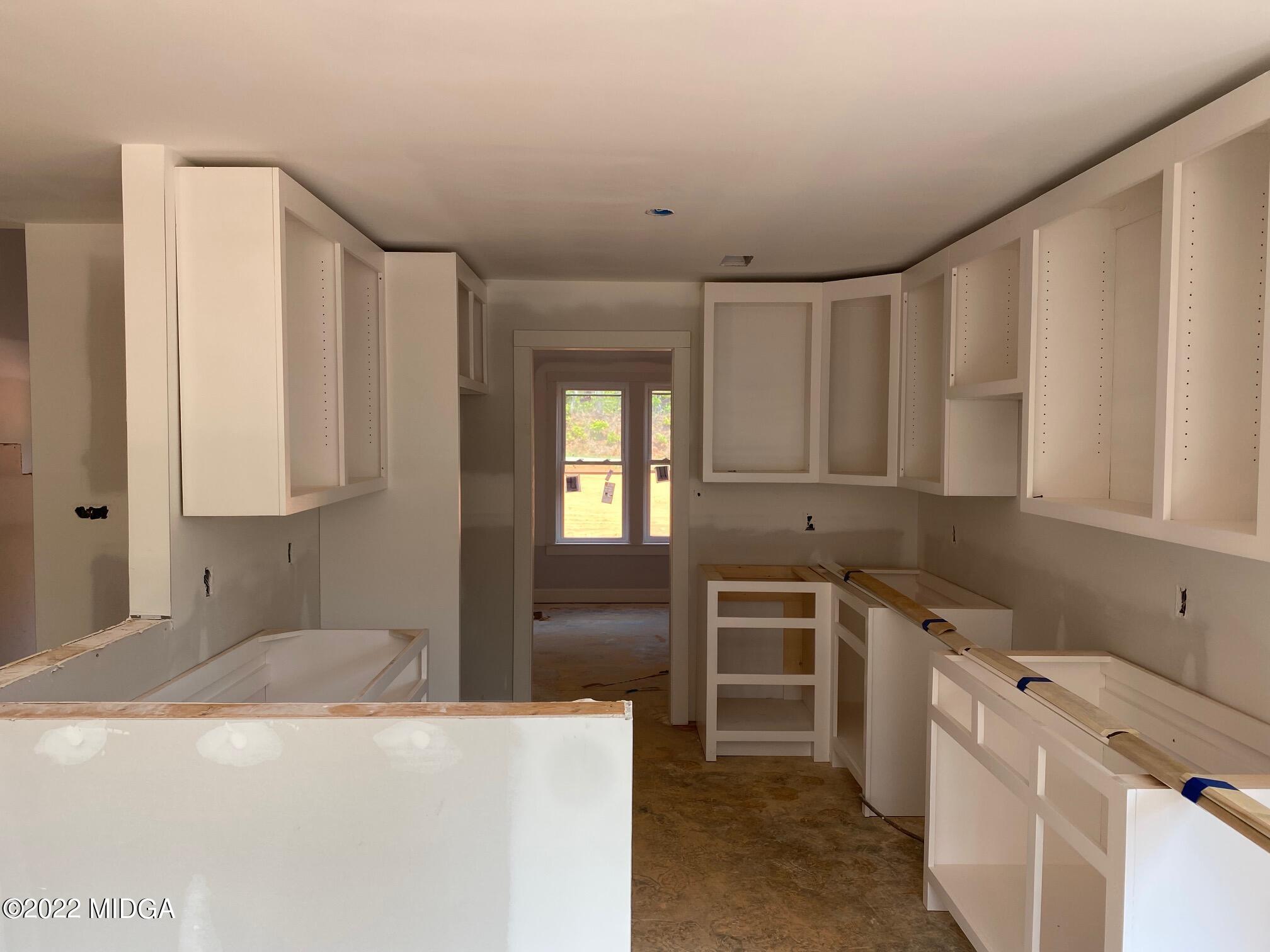 65 Jenkins Road Forsyth, GA 31029 - Photo 4 of 10 a kitchen that has a sink and a stove in it