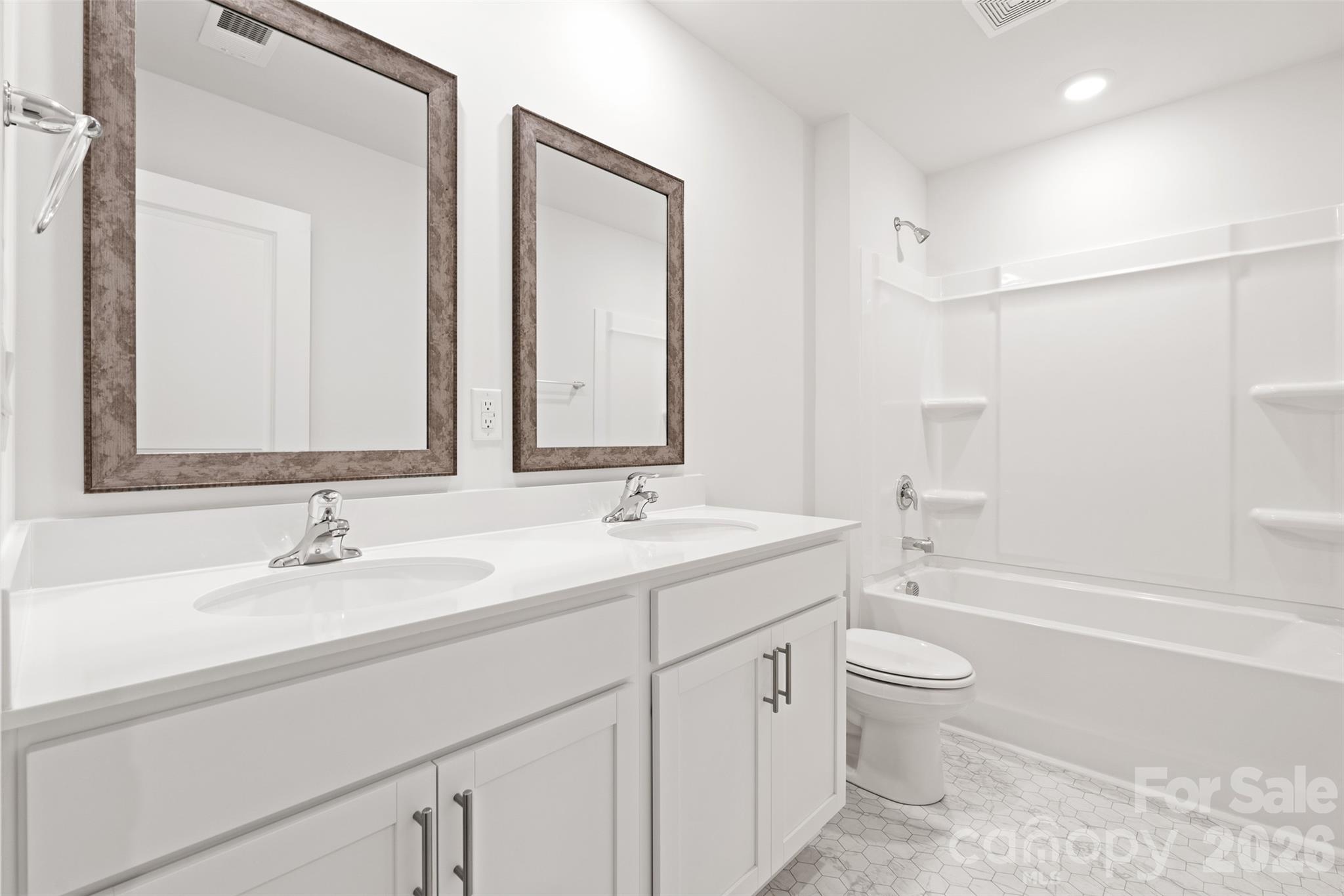 132 Salers Road Fletcher, NC 28732 - Photo 21 of 29 a bathroom with a sink double vanity granite toilet tub and shower
