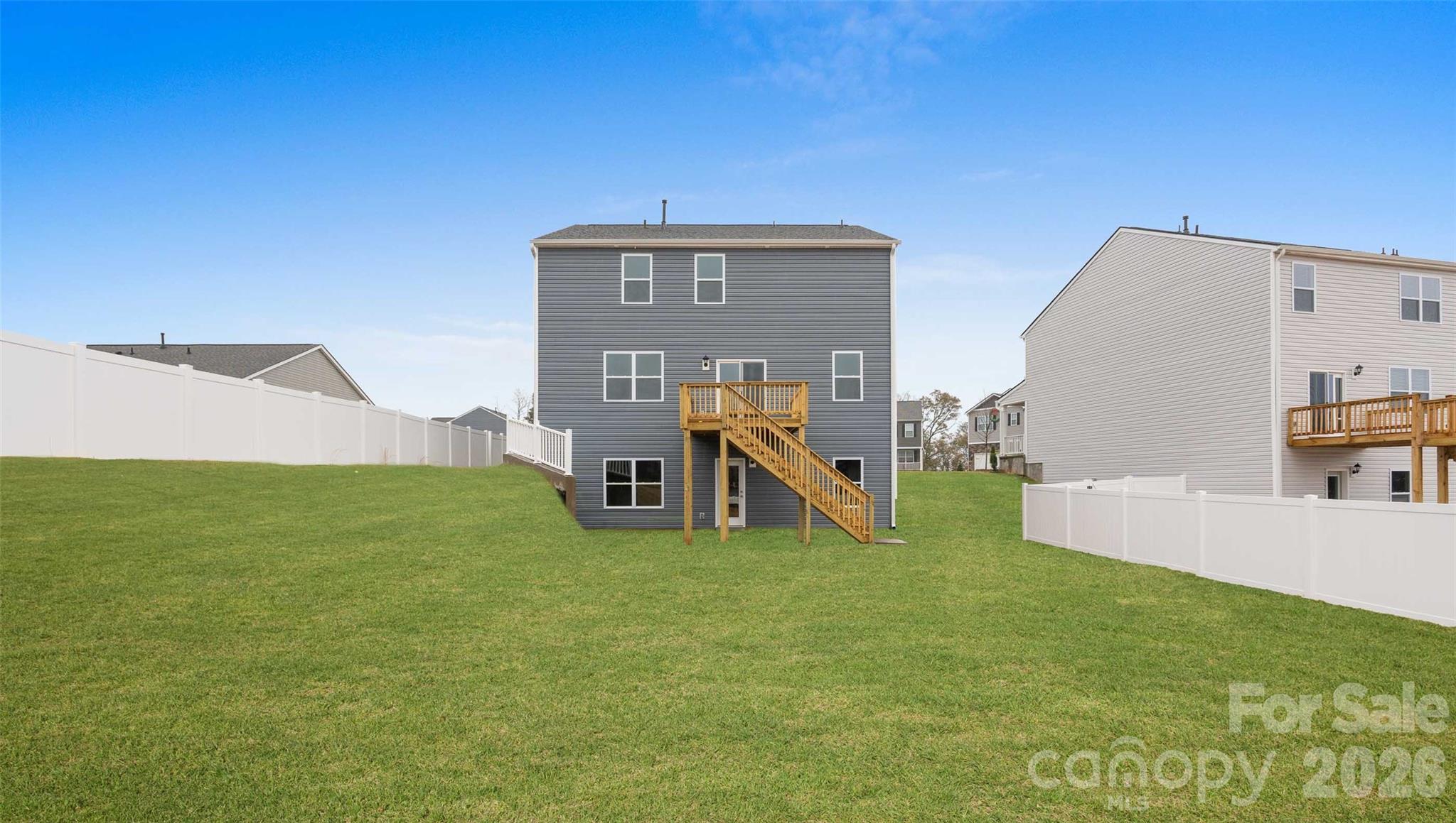 132 Salers Road Fletcher, NC 28732 - Photo 22 of 29 a view of a house with a backyard and a chair