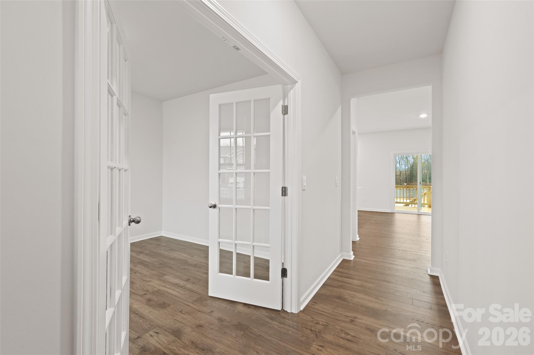 132 Salers Road Fletcher, NC 28732 - Photo 4 of 29 a view of a hallway with wooden floor and staircase