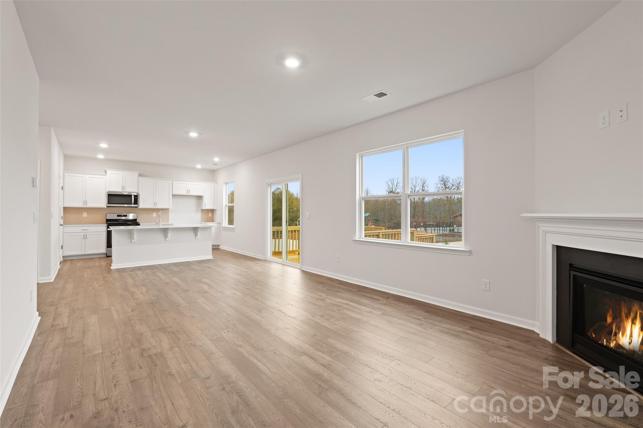 132 Salers Road Fletcher, NC 28732 - Photo 9 of 29 a view of kitchen with furniture and fireplace