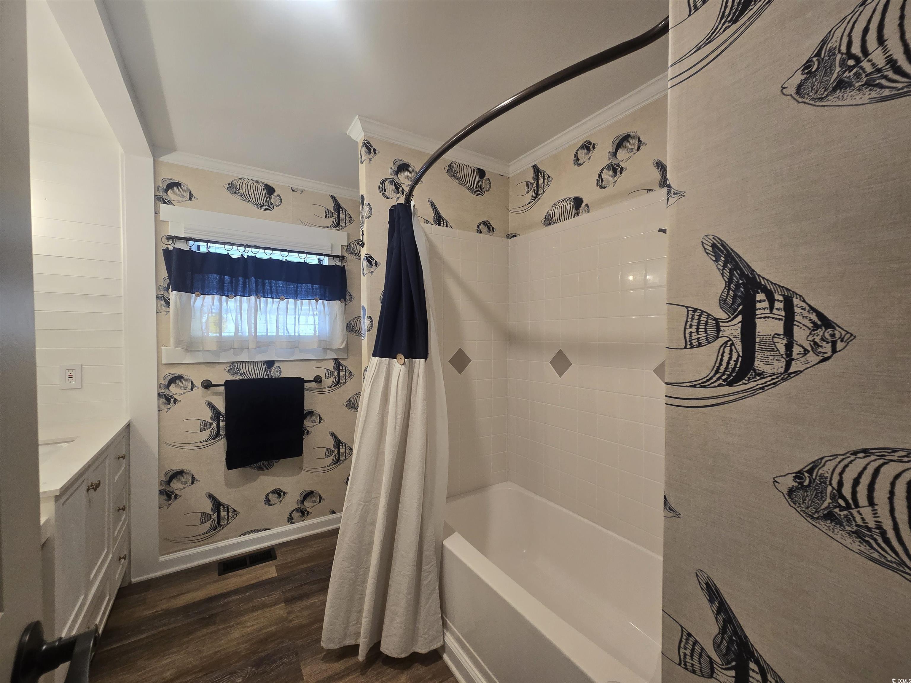 359 Lagoon Circle Murrells Inlet, SC 29576 - Photo 36 of 39 Full bath featuring vanity, dark wood-style flooring, crown molding, and shower / tub combo with curtain