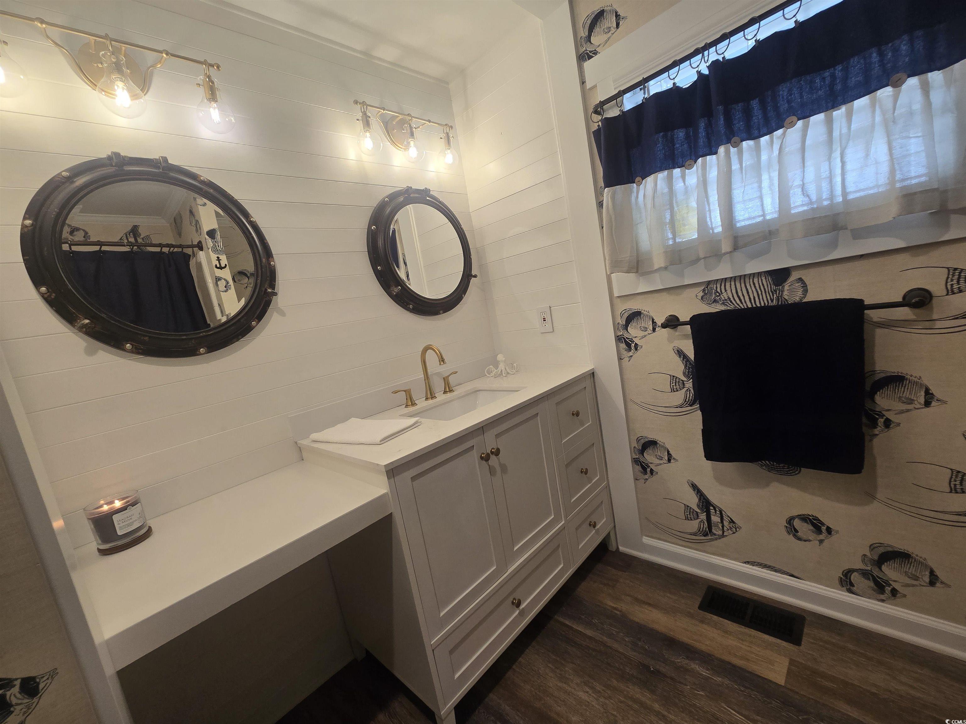 359 Lagoon Circle Murrells Inlet, SC 29576 - Photo 38 of 39 Bathroom with vanity, dark wood-style floors, and a shower with curtain