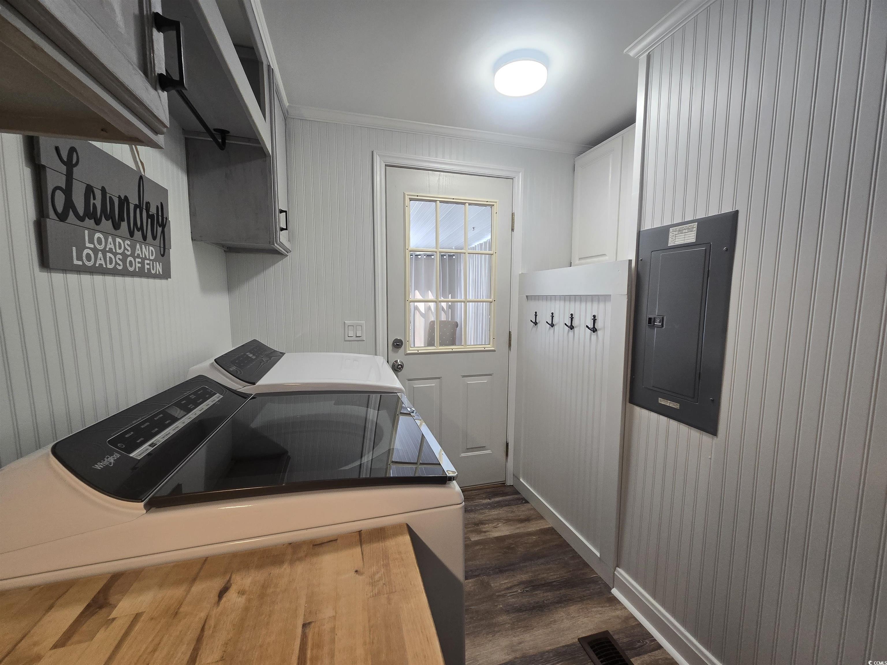 359 Lagoon Circle Murrells Inlet, SC 29576 - Photo 39 of 39 Washroom with crown molding, electric panel, dark wood-style flooring, and independent washer and dryer