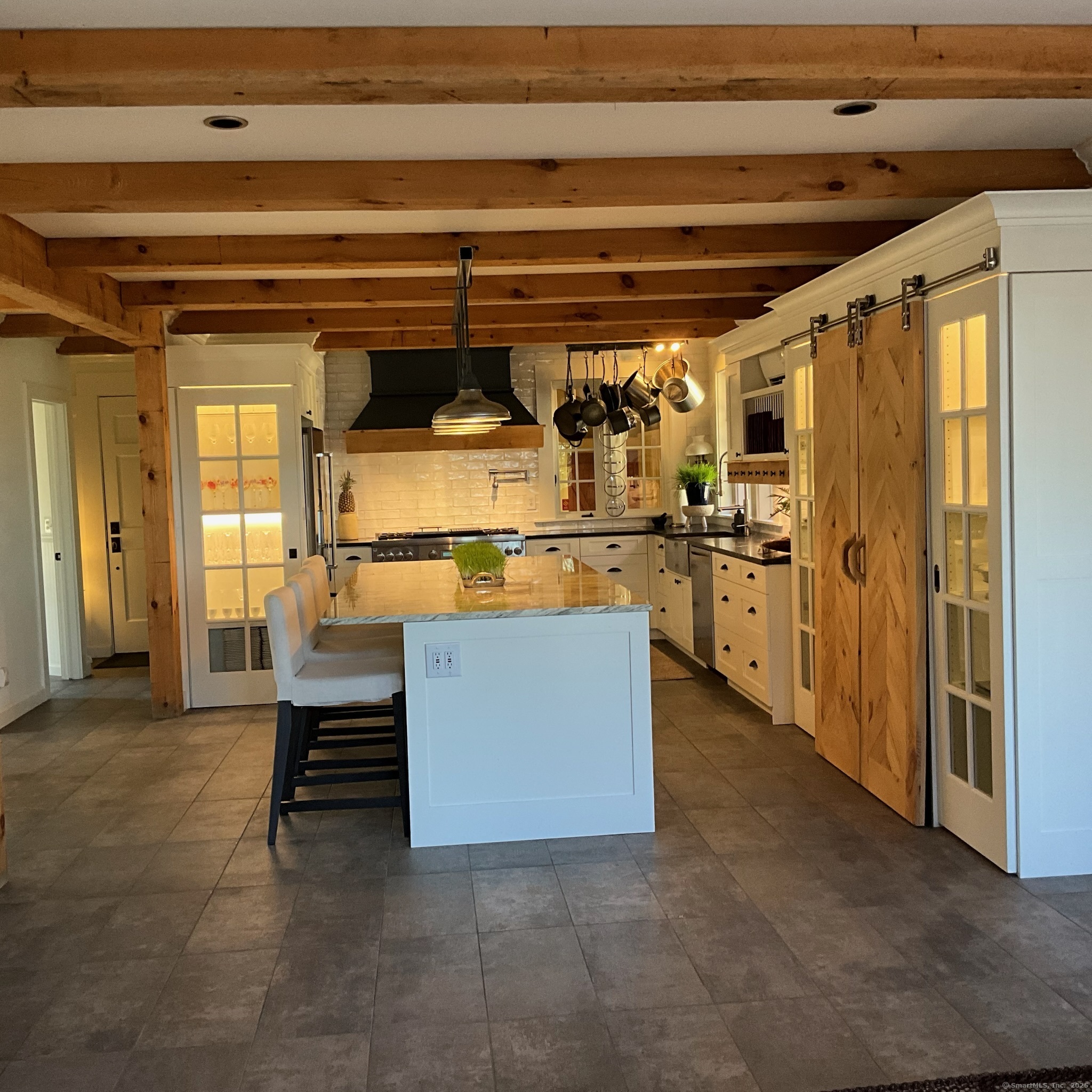 44 Brook Street Groton, CT 06340 - Photo 10 of 39 a view of kitchen with furniture and a refrigerator