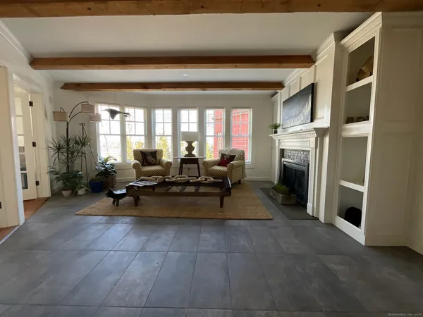 a view of kitchen with furniture and a refrigerator