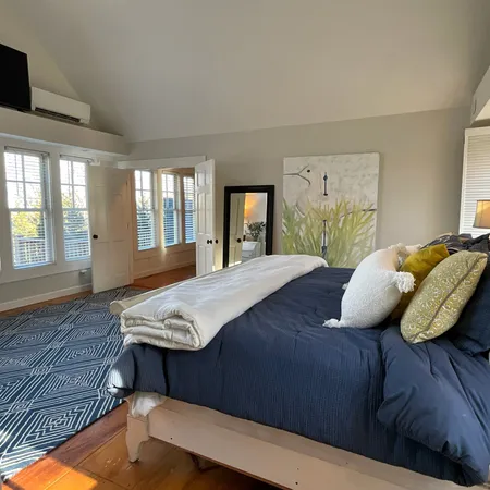 a bedroom with furniture and window