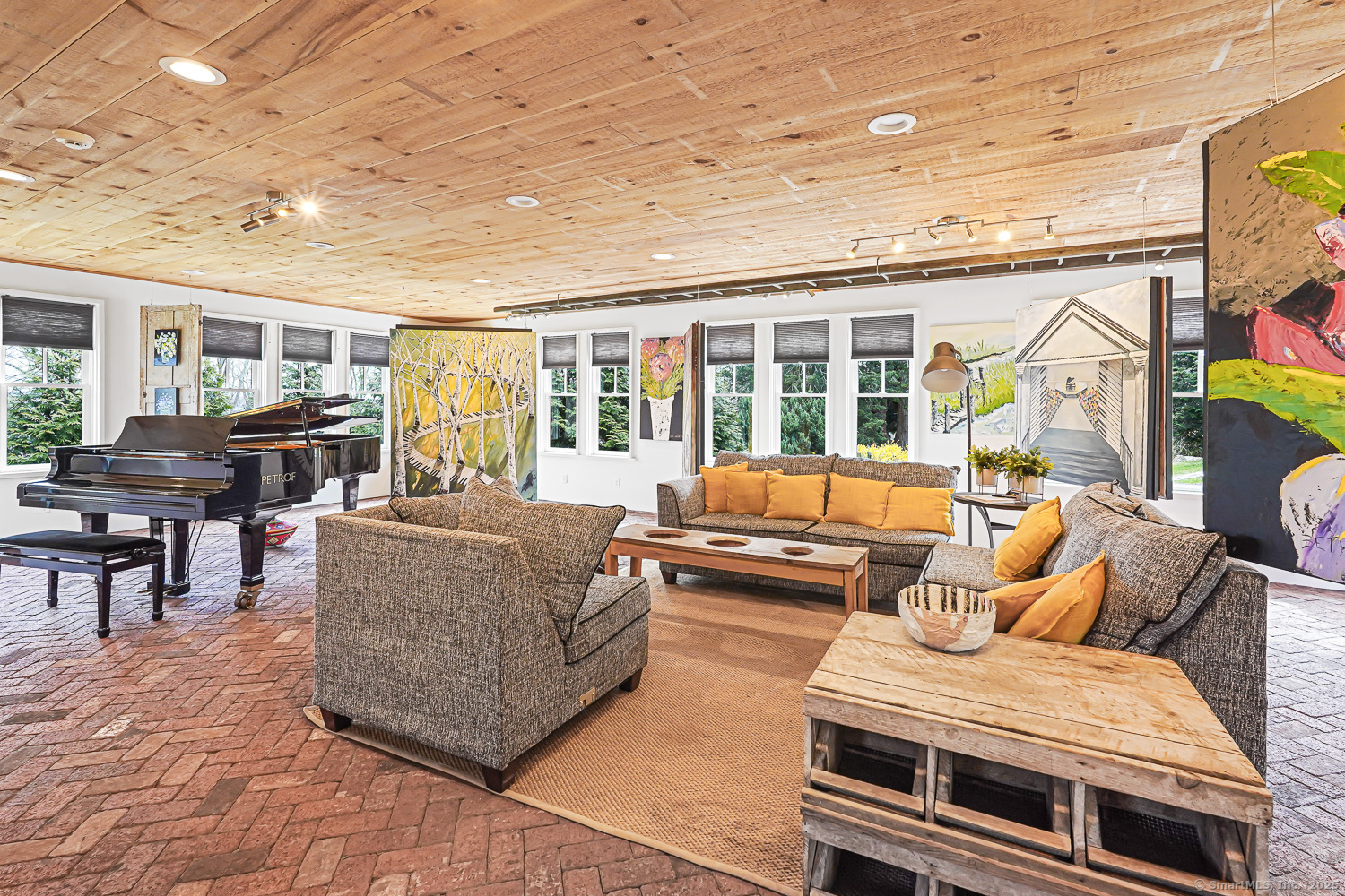 44 Brook Street Groton, CT 06340 - Photo 27 of 39 a living room with furniture and a large window