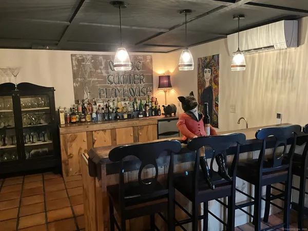 a view of a patio with a table and chairs