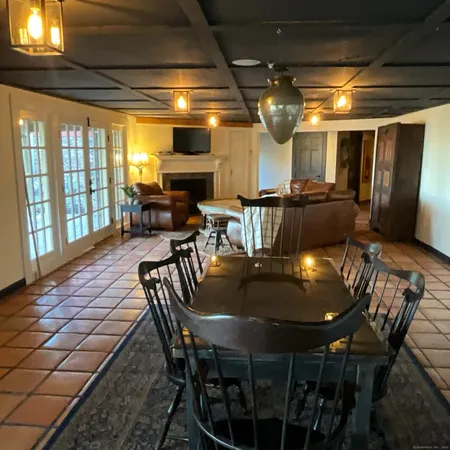 a dining room with furniture and window