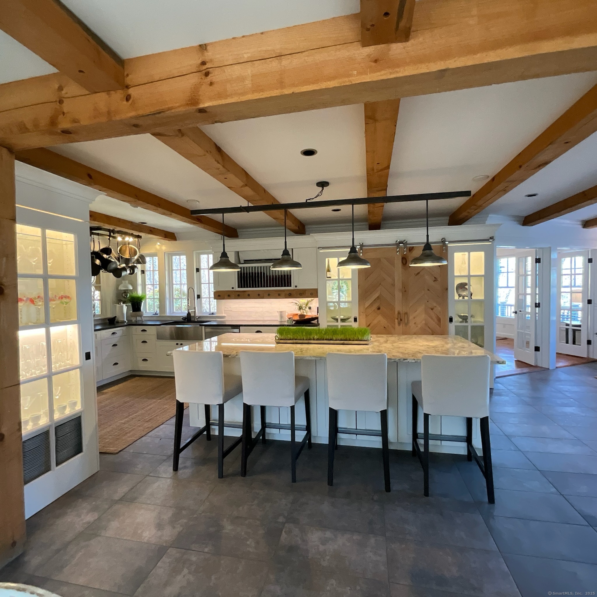 44 Brook Street Groton, CT 06340 - Photo 8 of 39 a kitchen with a table chairs and entryway