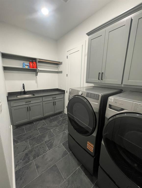 1484 Dixie Road Whitesboro, TX 76273 - Photo 11 of 18 a utility room with sink dryer and washer