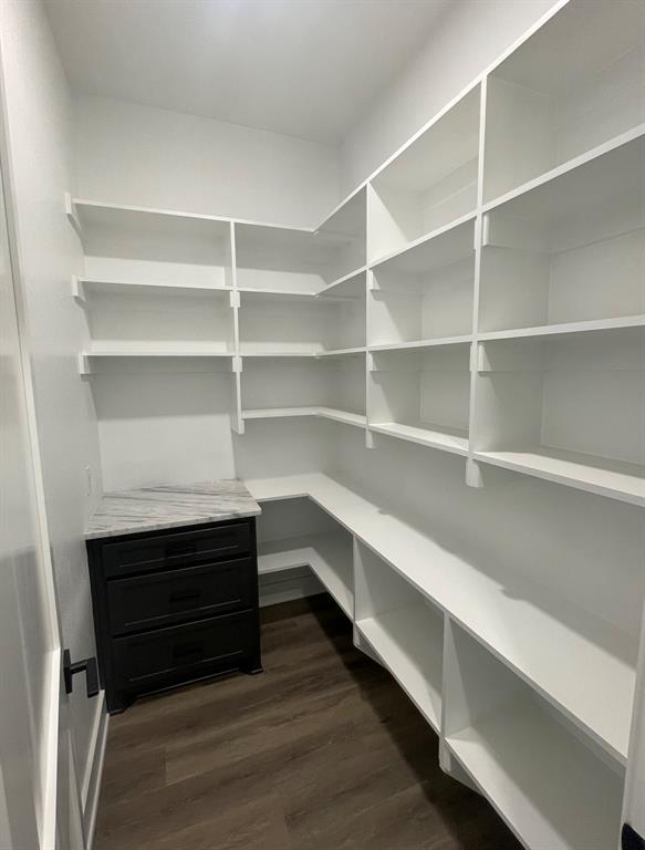 1484 Dixie Road Whitesboro, TX 76273 - Photo 12 of 18 a storage room with wooden floor