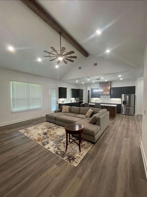 1484 Dixie Road Whitesboro, TX 76273 - Photo 3 of 18 a living room with furniture and a wooden floor