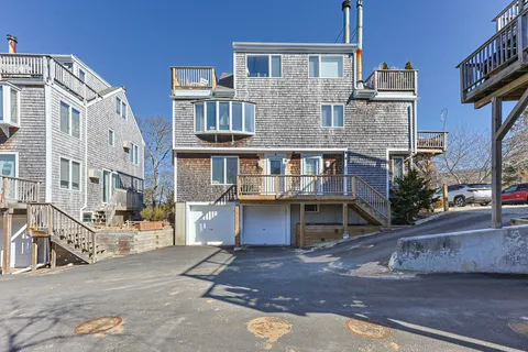 a front view of a building with a yard