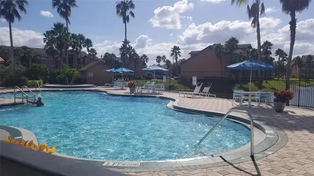 a view of a backyard with sitting area