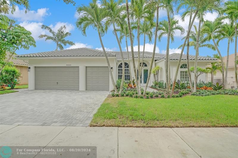Cooper City Hollywood, FL 33024 - Photo 1 of 39 a front view of a house with a garden and palm trees
