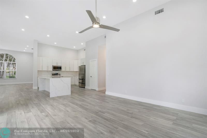 Cooper City Hollywood, FL 33024 - Photo 17 of 39 a view of kitchen with granite countertop cabinets and refrigerator
