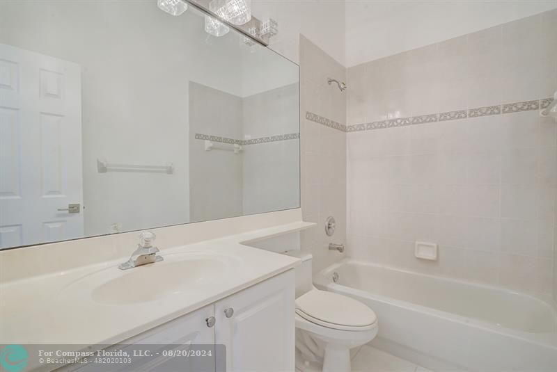 Cooper City Hollywood, FL 33024 - Photo 28 of 39 a bathroom with a sink a toilet and a bathtub