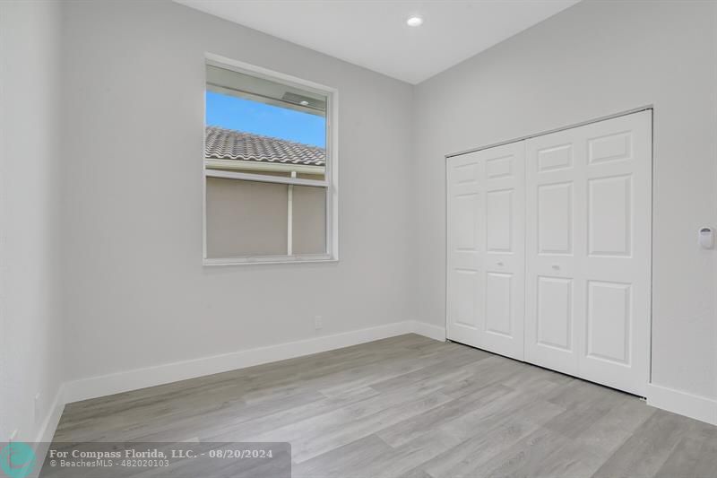 Cooper City Hollywood, FL 33024 - Photo 29 of 39 a view of an empty room with wooden floor and a window