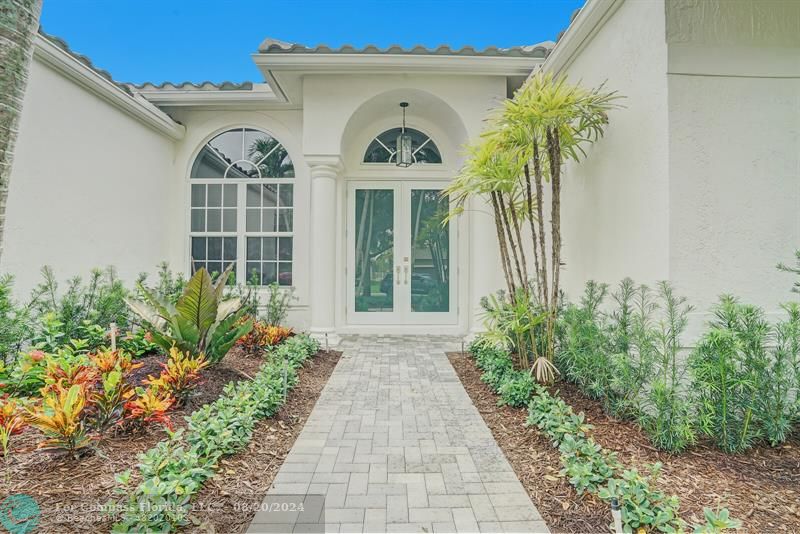 Cooper City Hollywood, FL 33024 - Photo 4 of 39 a front view of a house with garden