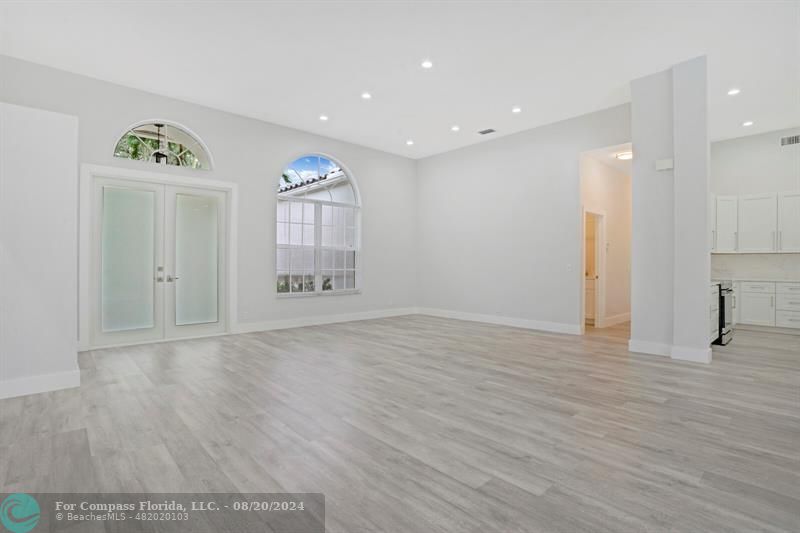 Cooper City Hollywood, FL 33024 - Photo 10 of 39 a view of an empty room with window and wooden floor