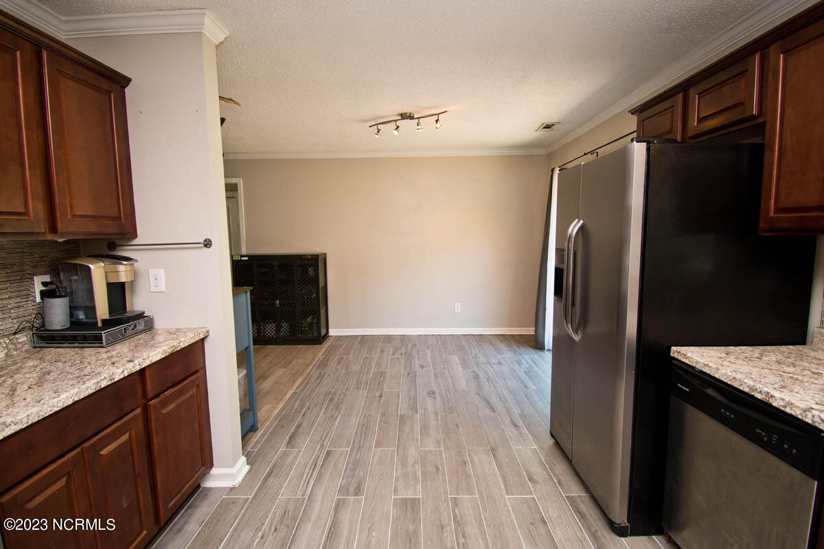 249 Sand Ridge Road Hubert, NC 28539 - Photo 19 of 27 flow into the dining area from kitchen