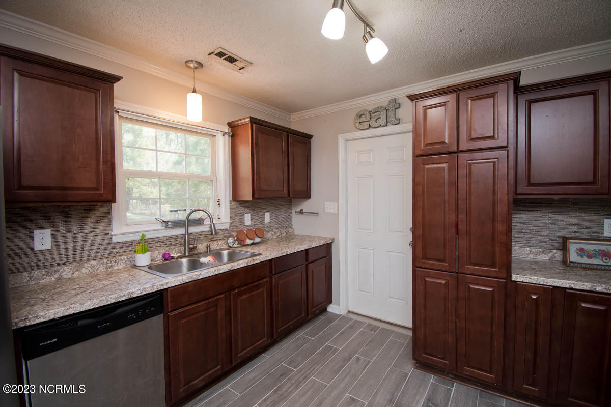 249 Sand Ridge Road Hubert, NC 28539 - Photo 21 of 27 pantry and garage