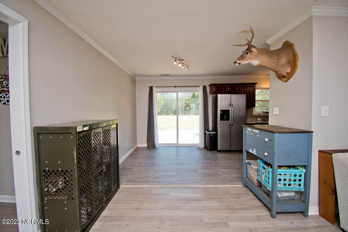 249 Sand Ridge Road Hubert, NC 28539 - Photo 4 of 27 flow from living to dining/kitchen