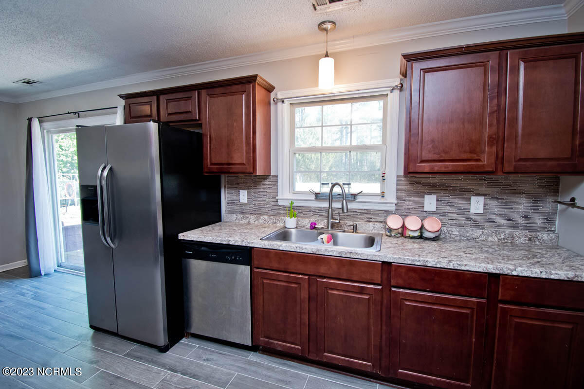 249 Sand Ridge Road Hubert, NC 28539 - Photo 6 of 27 lots of light in roomy kitchen