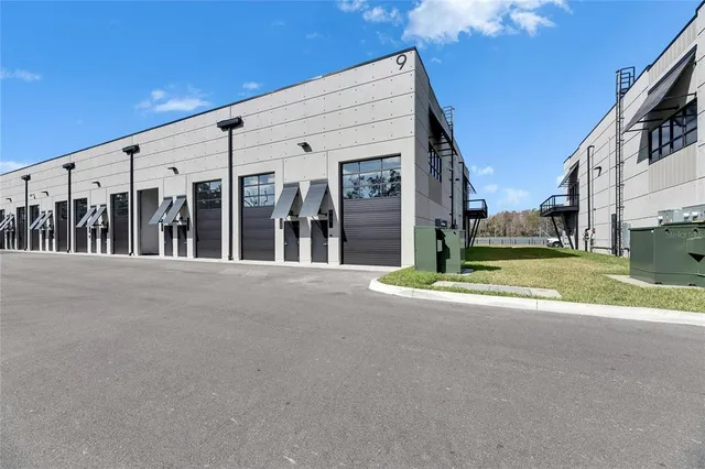 a view of kitchen with refrigerator and window