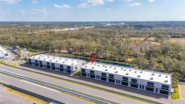 an aerial view of a chairs and table on the terrace